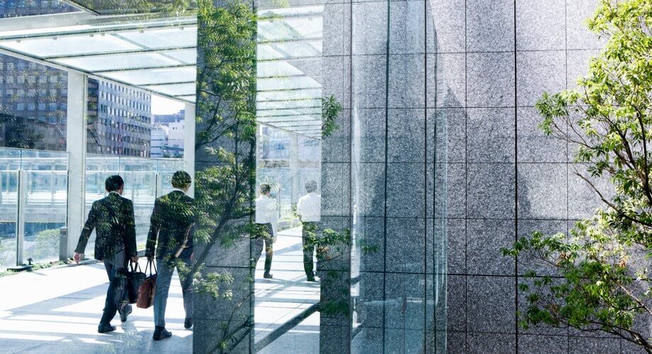 Men walking through an office