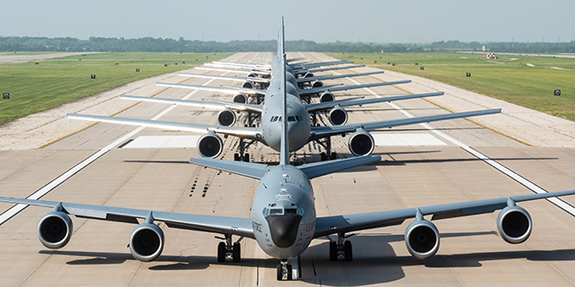 Military aircrafts parked on a runway