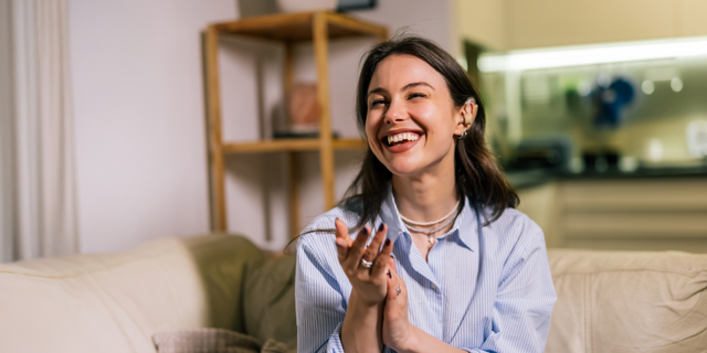 Woman smiling holding her hands
