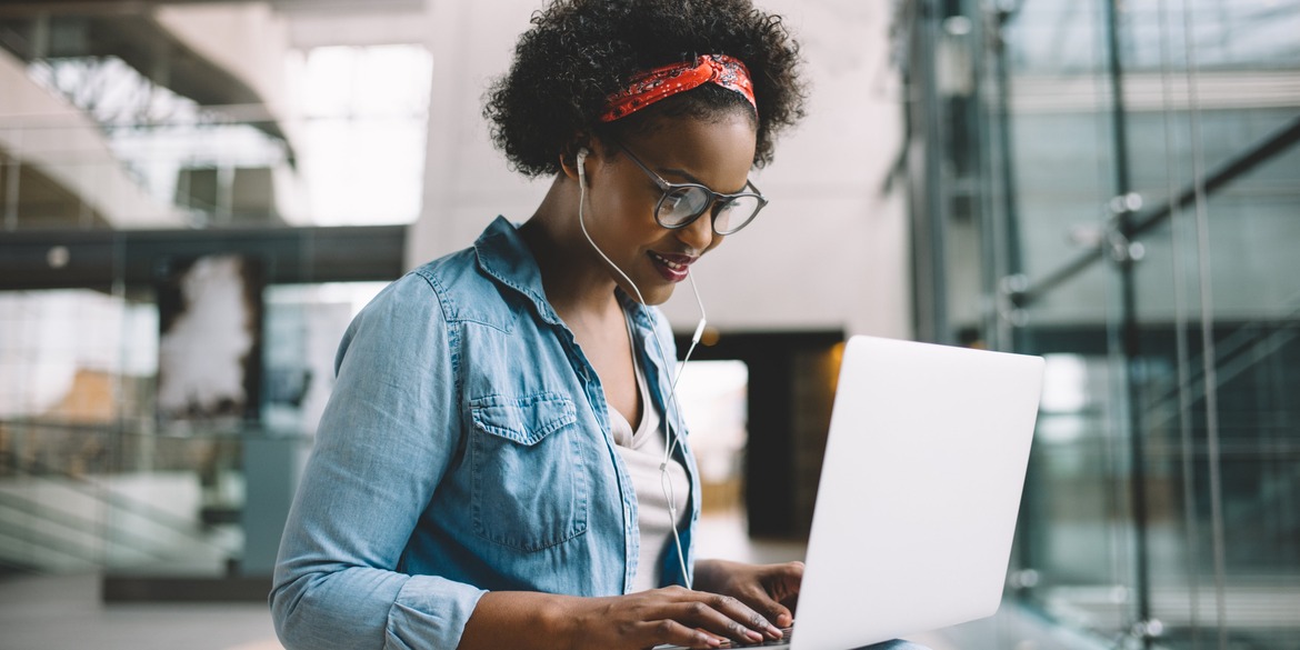 woman smiling using laptop
