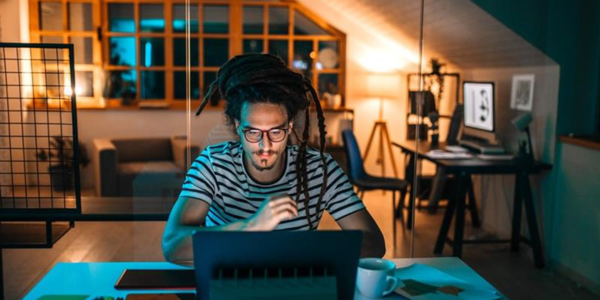 Man on laptop.