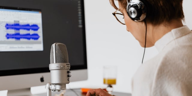 Woman working with audio editing software