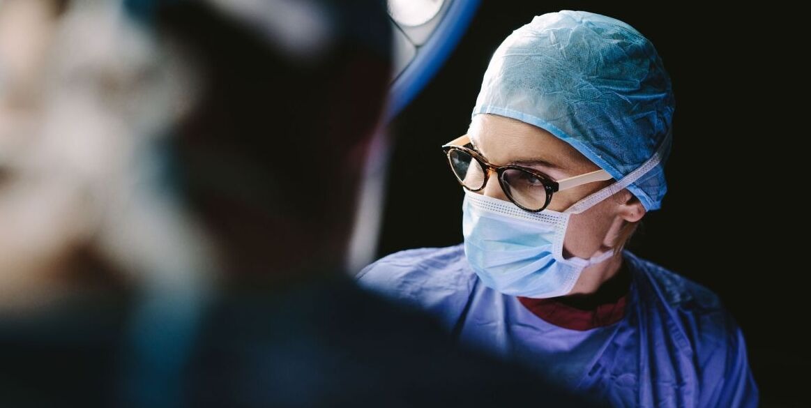 Doctor wearing surgical mask in an operating theatre