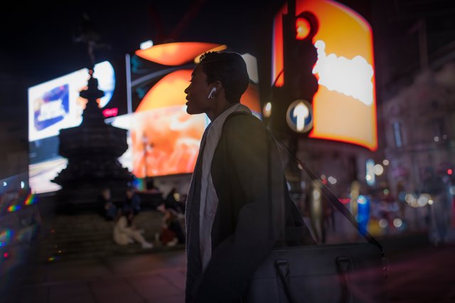 Women in city with bright lights