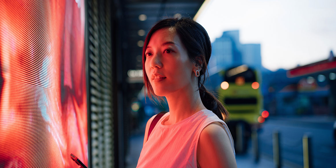 Woman looking at digital screen